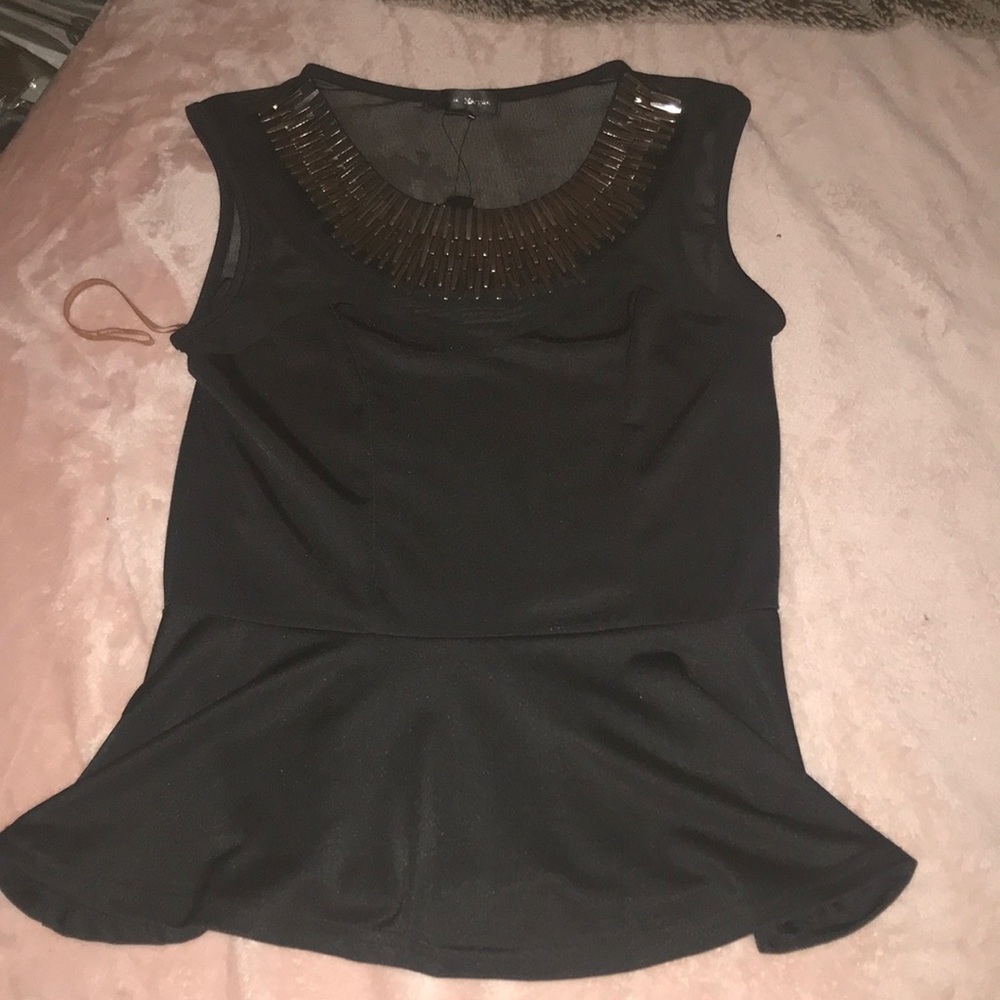 Peplum embellished top from Caroline Morgan